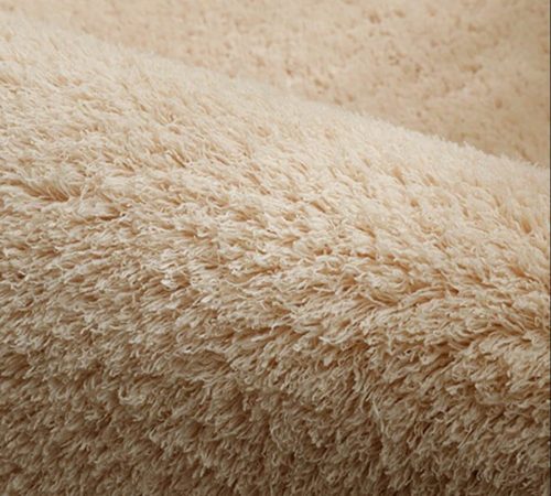 Texture d'un tapis beige de chambre de bébé